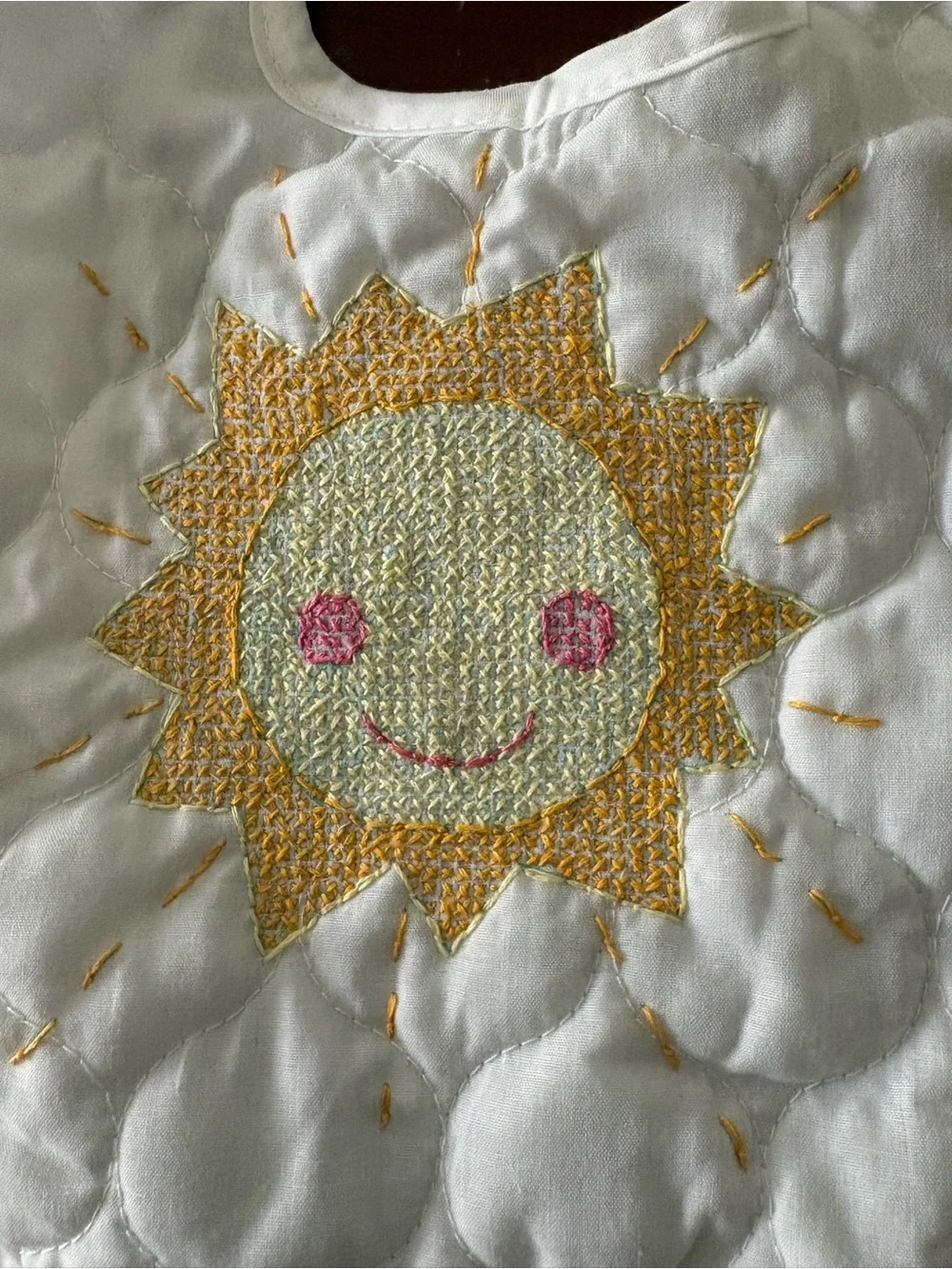 Hand embroidered sun quilted baby bib